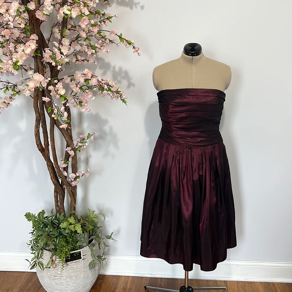 Burgundy strapless tea length dress.